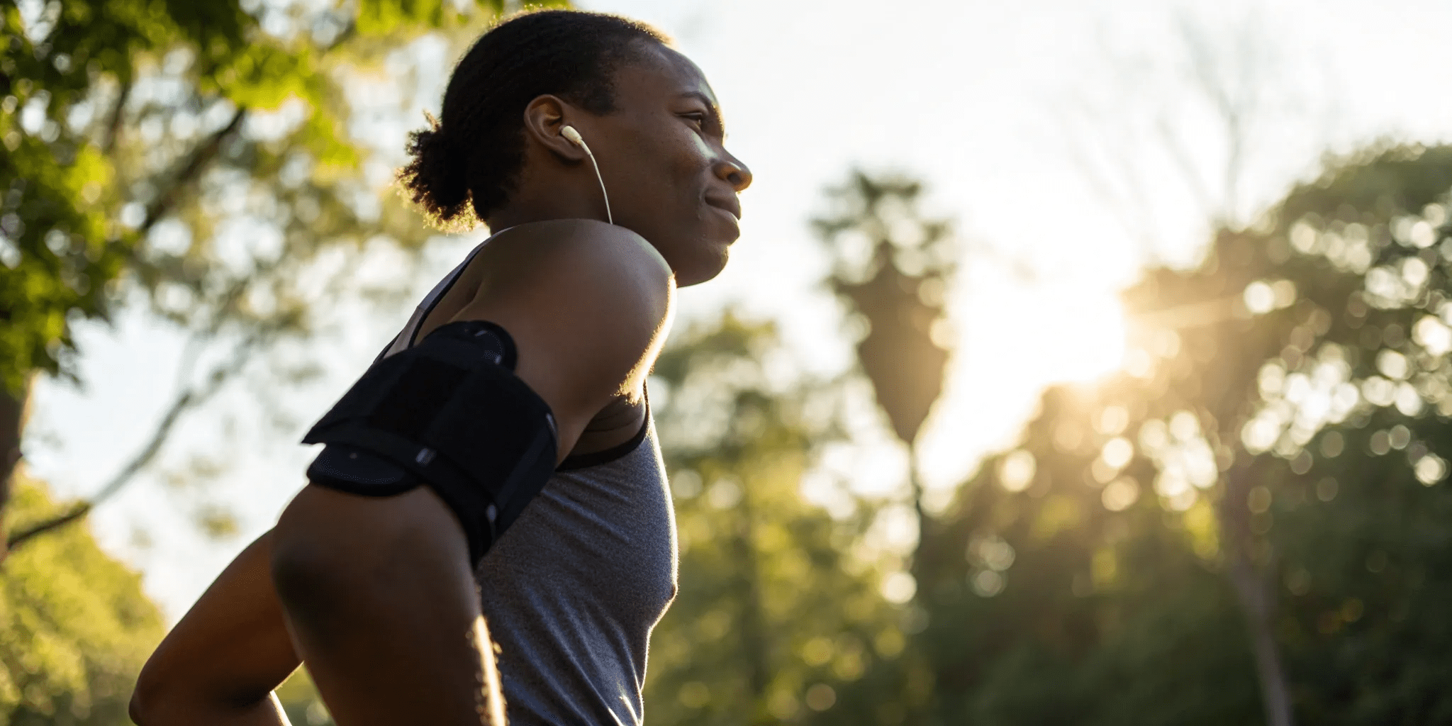 Grade 1 Bicep Tear: Symptoms & Recovery Guide 1 Man in workout clothes resting his arm, recovering from a grade 1 bicep tear.