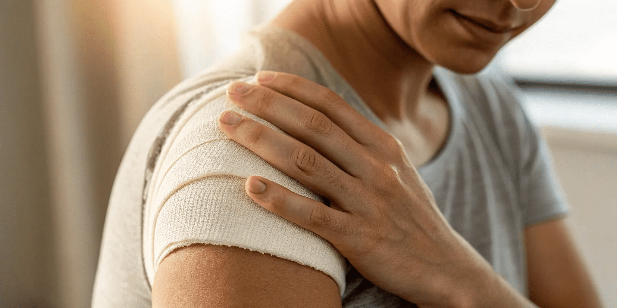 Strain of Rotator Cuff of Shoulder ICD 10 Explained 1 A person holding their bandaged shoulder due to a rotator cuff strain, a diagnosis coded with ICD-10.